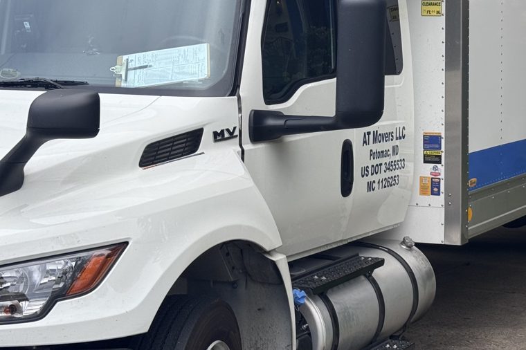 AT Movers truck door with USDOT 3455533 and MC 1126253 lettering