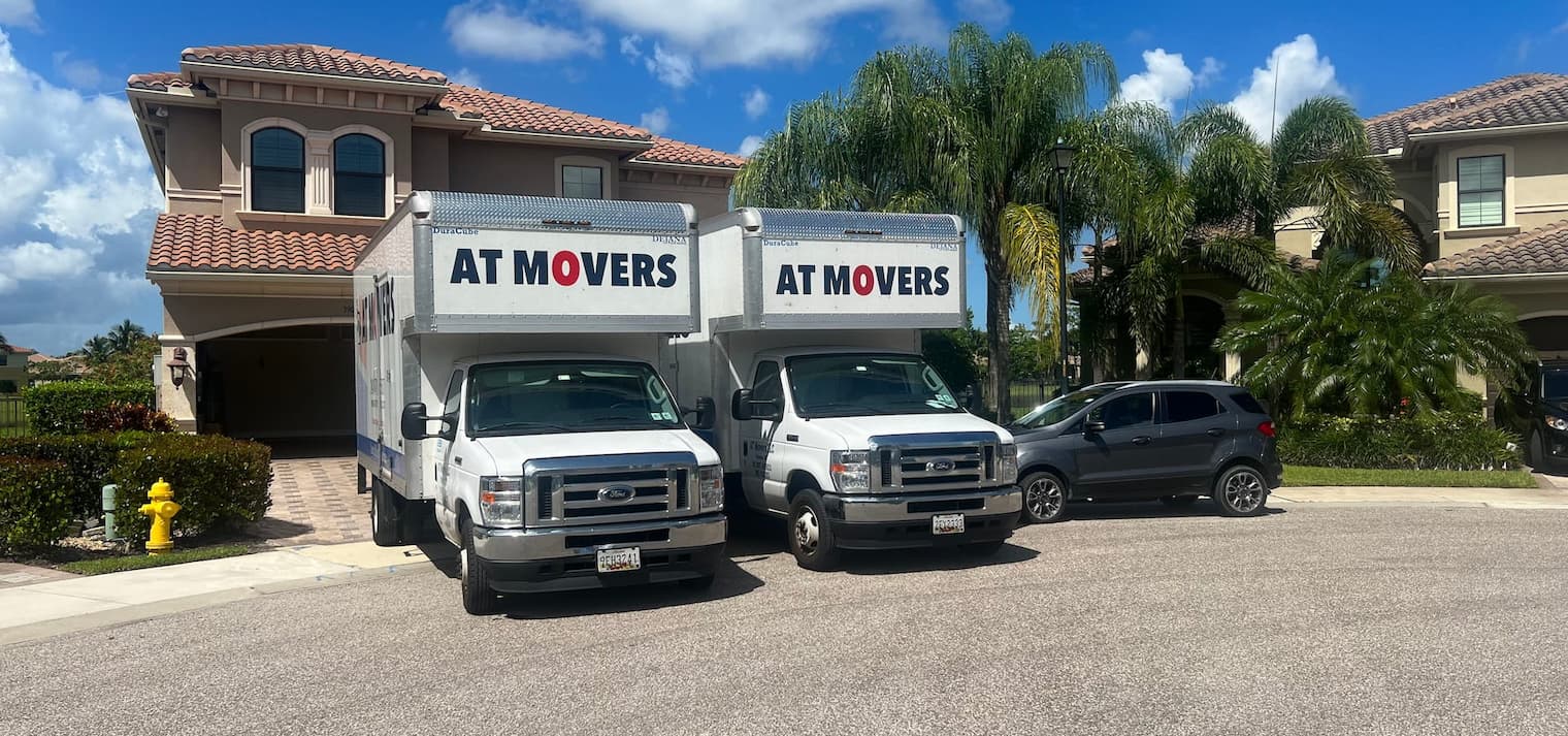AT Movers Truck Open Near House
