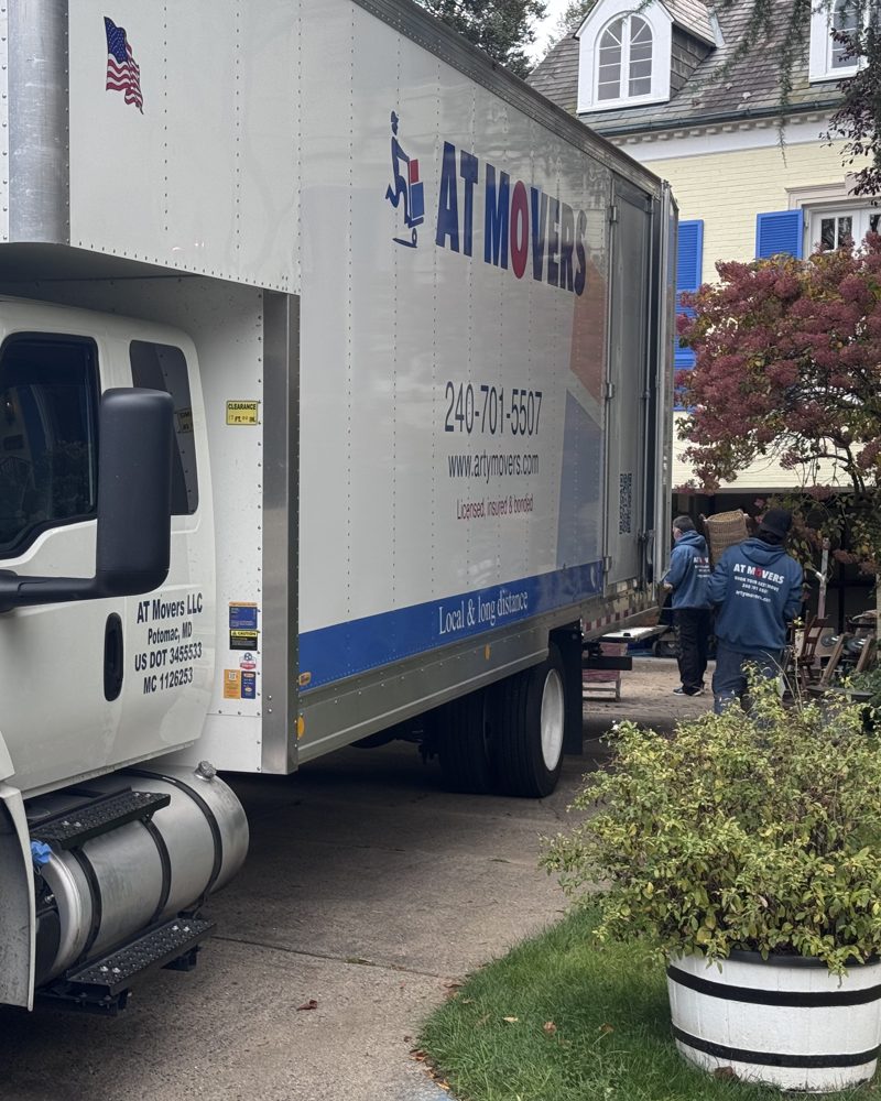 AT Movers truck loading at a customer's home