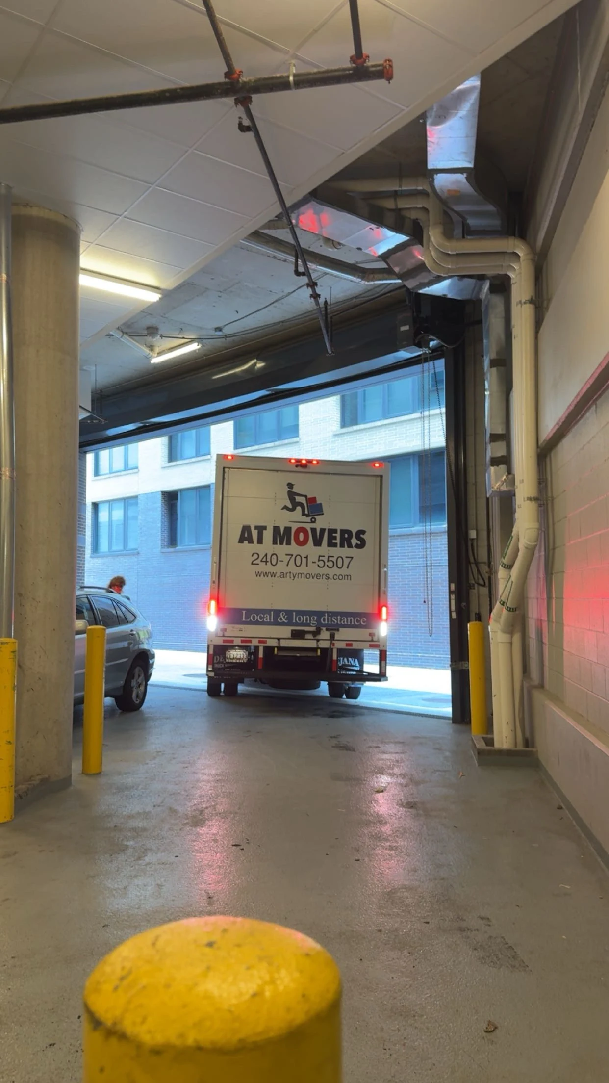 AT Movers truck loading at a customer's home