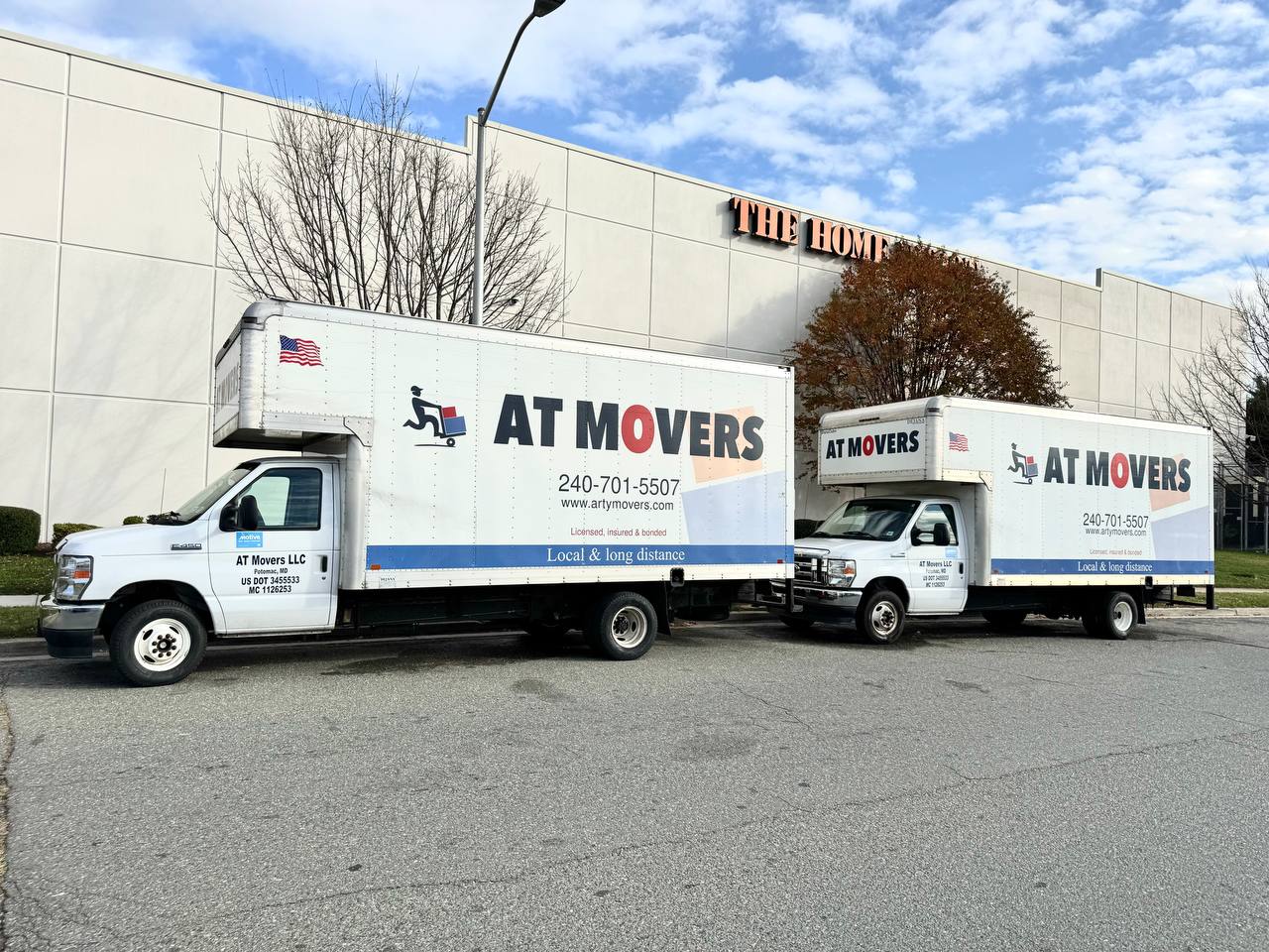 AT Movers Truck Open Near House
